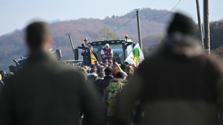 President of the Rural Coordination (CR) in Ariège Sebastien Durand (L) and regional figure of the agricultural protest movement Jerome Bayle (R) attend a farmers' protest against the slaughter of a 200-cow herd, following detection of lumpy skin disease (LSD) in Les-Bordes-sur-Arize, in the Ariège department of southwestern France, on December 11, 2025.