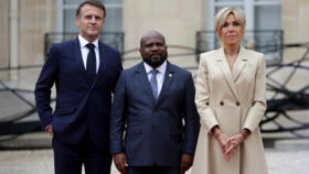 France's President Emmanuel Macron and Brigitte Macron greet Haiti's President of the transitional council Smith Augustin at the Elysee presidential palace in Paris, on July 26, 2024.