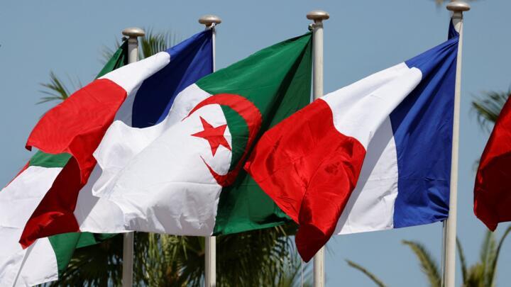 This picture taken on August 25, 2022 shows the French and Algerian flags.