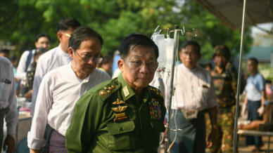 Myanmar's military chief Min Aung Hlaing (C) in Naypyidaw on March 28, 2025, after an earthquake in central Myanmar