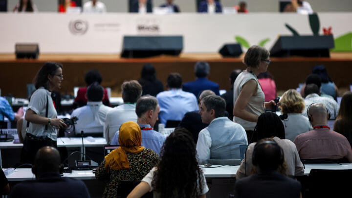 Negotiators attend a plenary session during the UN Climate Change Conference (COP30), in Belem, Brazil, November 21, 2025.