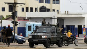A military vehicle patrols a street in Cotonou, Benin, on December 8, 2025, a day after the country's armed forces thwarted an attempted coup.