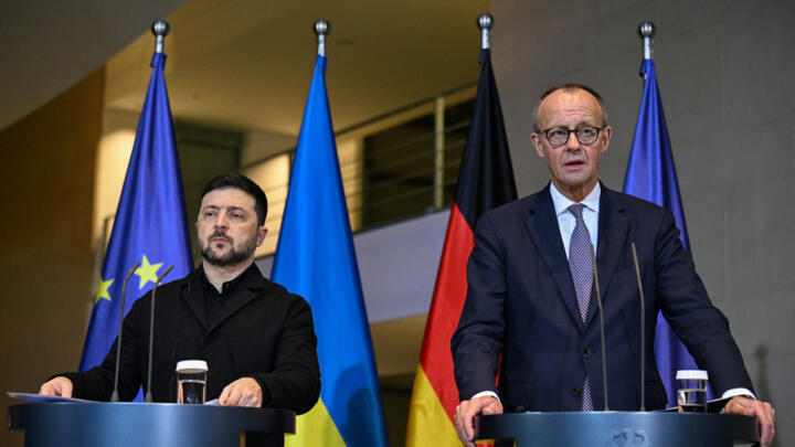 German Chancellor Friedrich Merz and Ukrainian President Volodymyr Zelensky attend a press conference, at the Chancellery in Berlin.