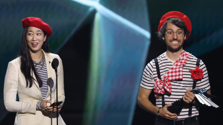 Jennifer Svedberg Yen (L) and Guillaume Broche, creators of the video game 'Clair Obscur: Expedition 33' along with the rest of their team attended the Game Awards wearing red berets from a character 